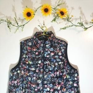 Woman within floral black vest